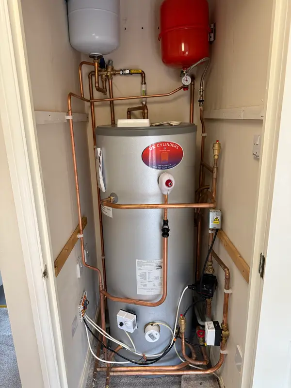 Unvented hot water cylinder with expansion vessels and copper pipework