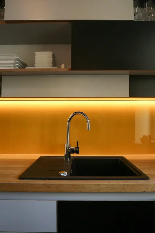 Modern kitchen tap over a black sink